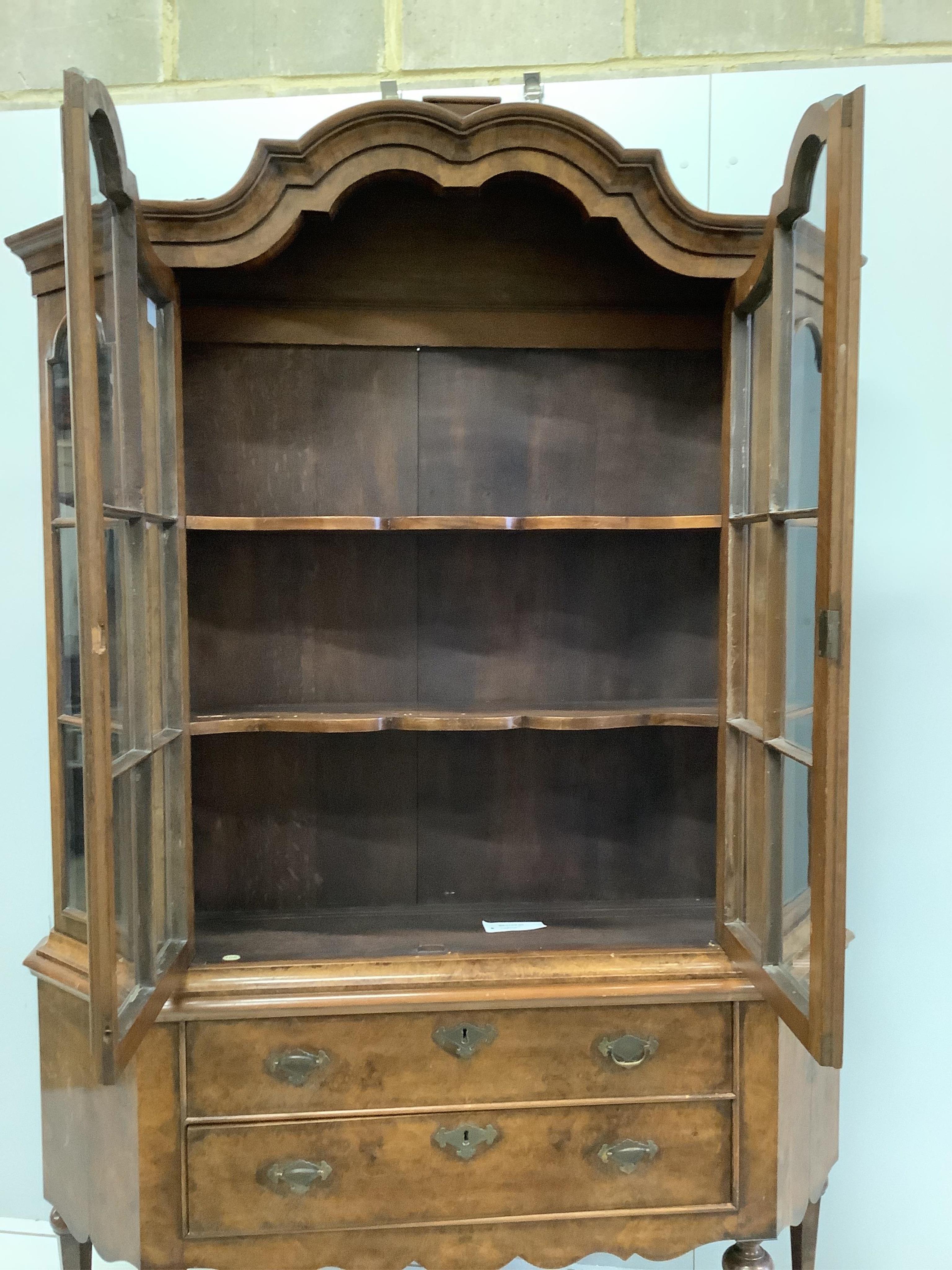 An 18th century style Dutch walnut display cabinet, width 136cm, depth 33cm, height 208cm. Condition - fair to good